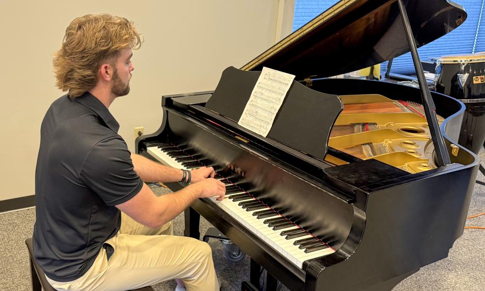 Sean Stone plays the piano at Lincoln Trail College