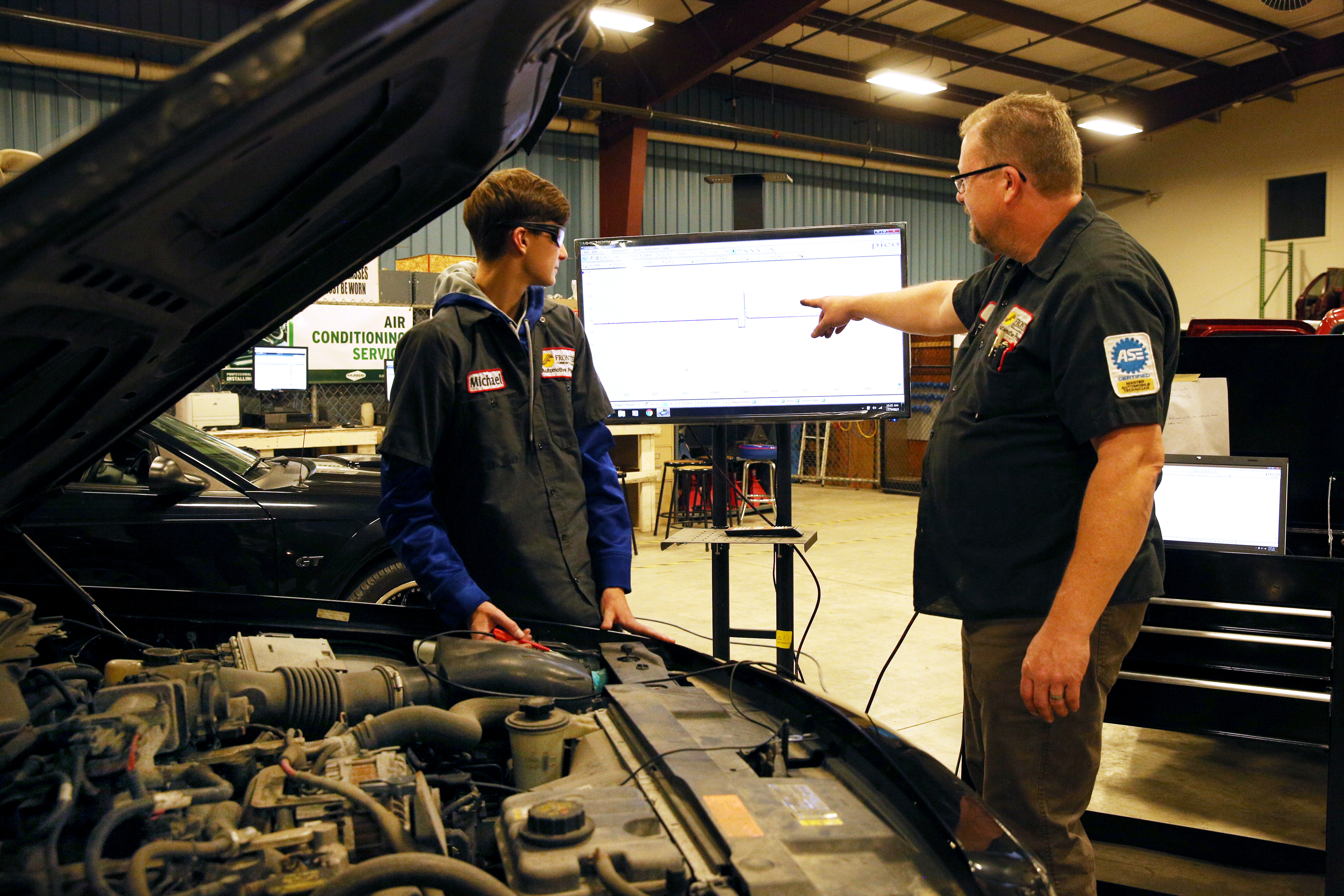 Student and instructor in the automotive lab