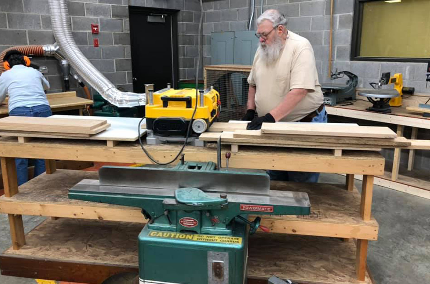 Man in the Woodworking Shop cutting boards