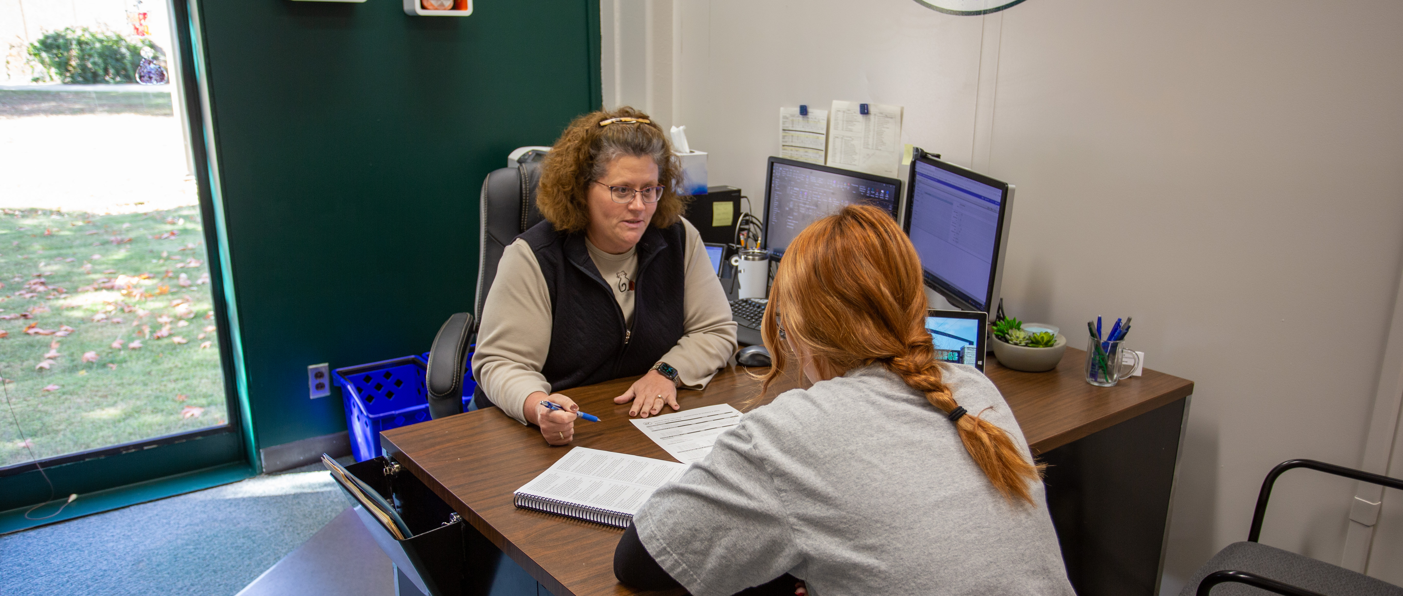 Angel Kerner advises a student at Lincoln Trail College