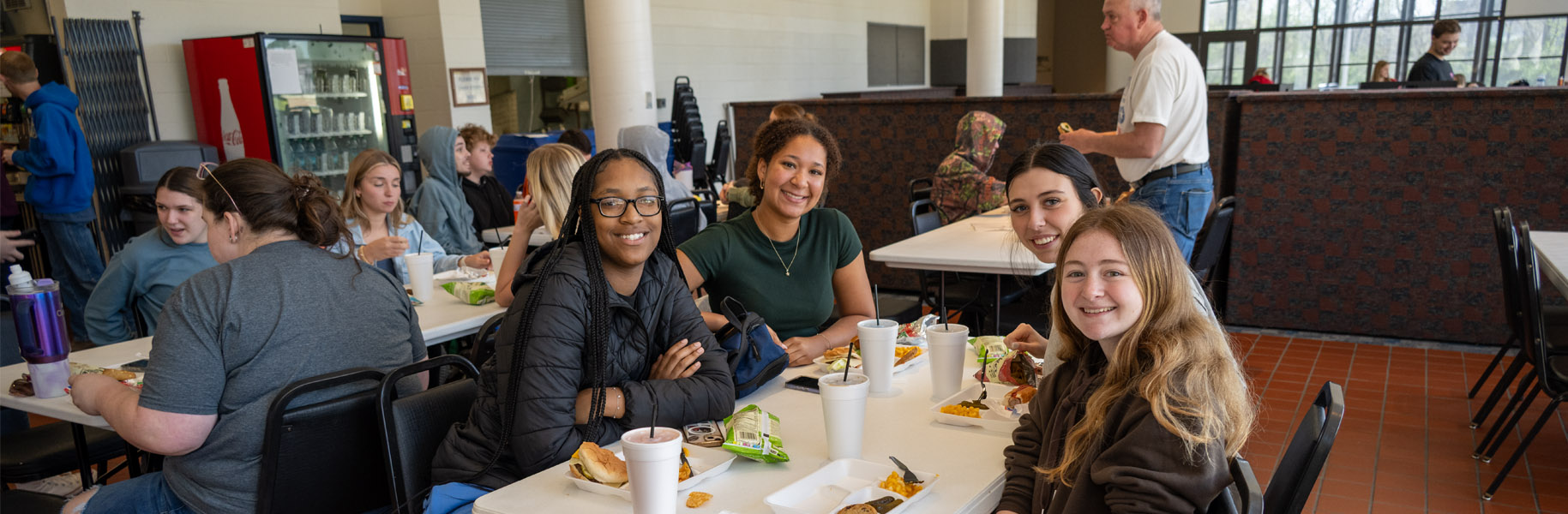 Students sitting at tables enjoying Spring Fling luncheon