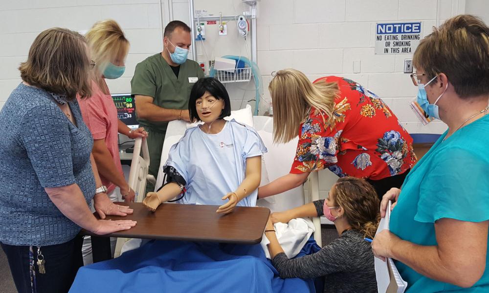 Nursing Instructors working with Simulator