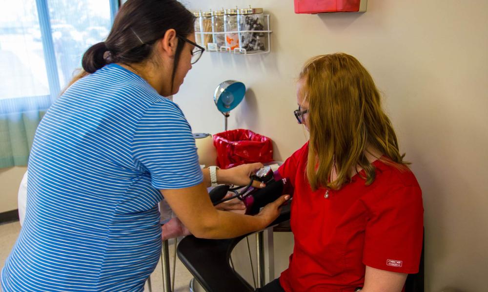 Nurse checking blood pressure