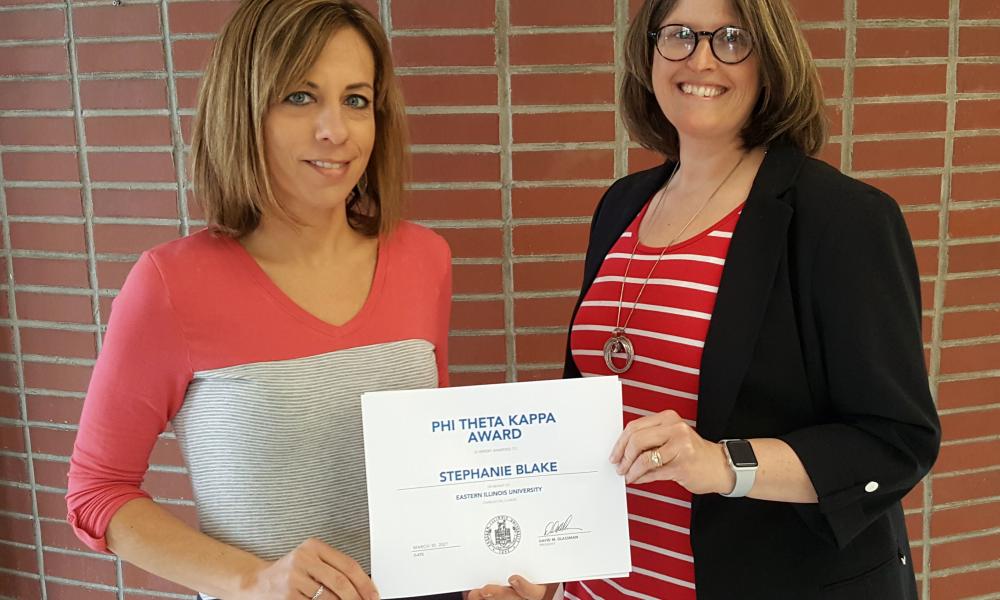 Stephanie Blake and Amie Mayhall holding PTK Scholarship Award