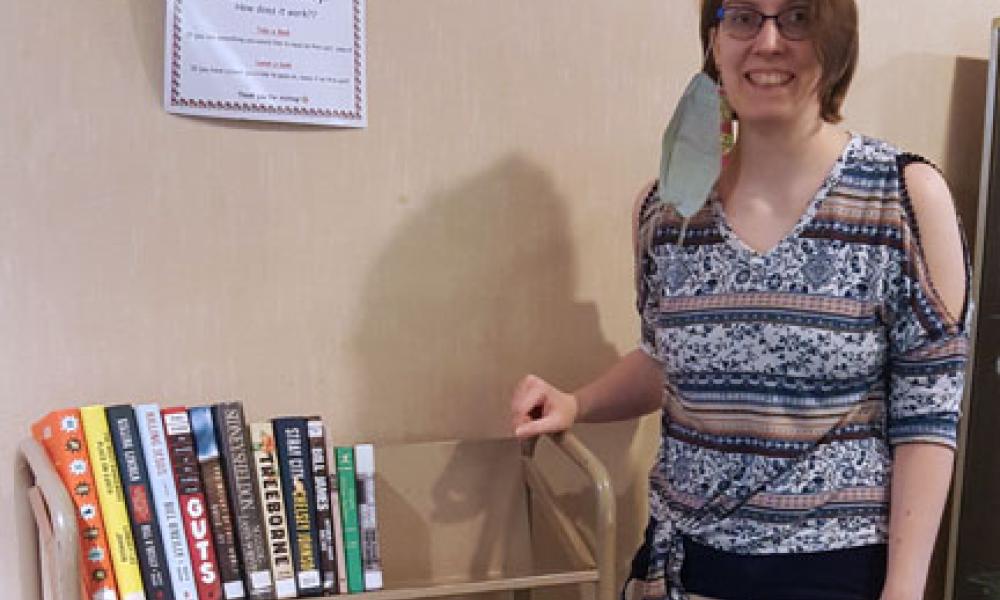 Photo of Kaitlyn Weger with the Little Library Cart