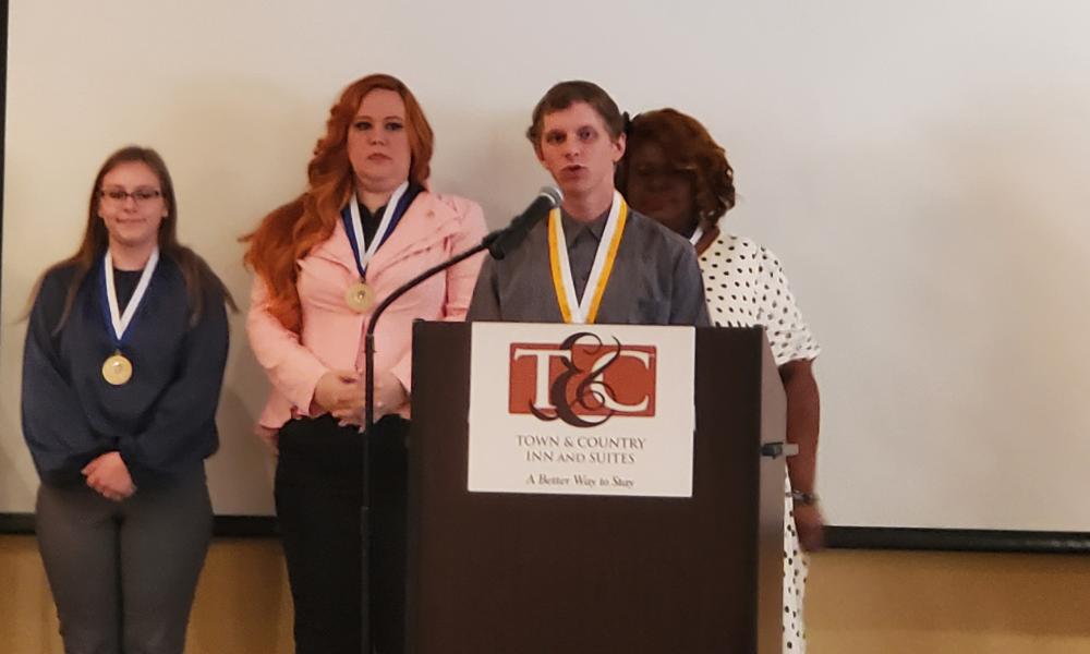 Ethan Żakowski speaks at Phi Theta Kappa event