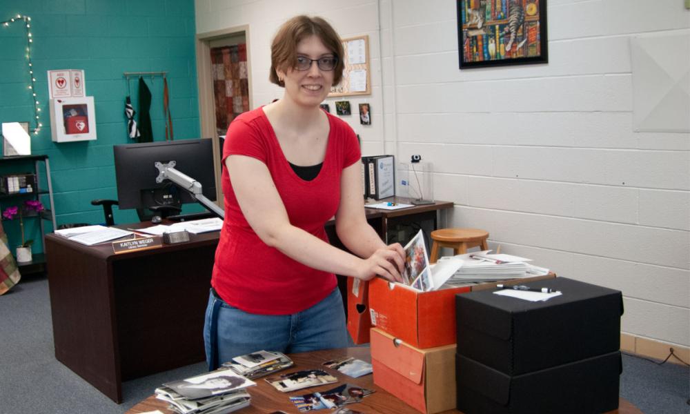 Kaitlyn Weger Reorganizing Photos Housed in the OCC Archives