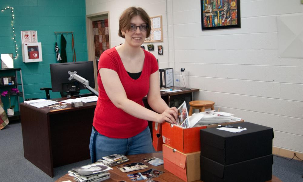 Kaitlyn Weger Reorganizing Photos Housed in the OCC Archives