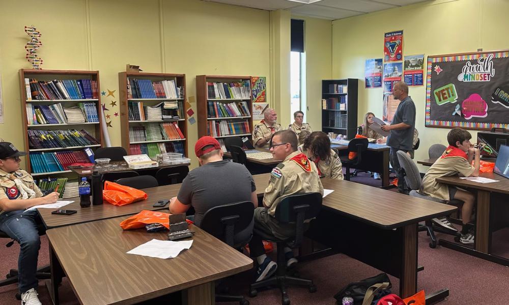 Jackson Hemrich leads a merit badge event about Coin Collecting