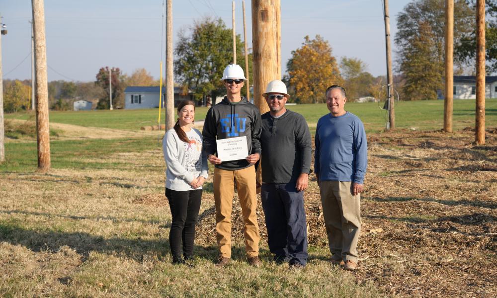 Academic Advisor Kara Blanton, Maddox McElravy, EDS Instructor Dustin Wiggins and Chief Academic Officer & Dean of Instruction Paul Bruinsma; Photo is of Maddox being a recipient of the Steve Rafferty Memorial Scholarship