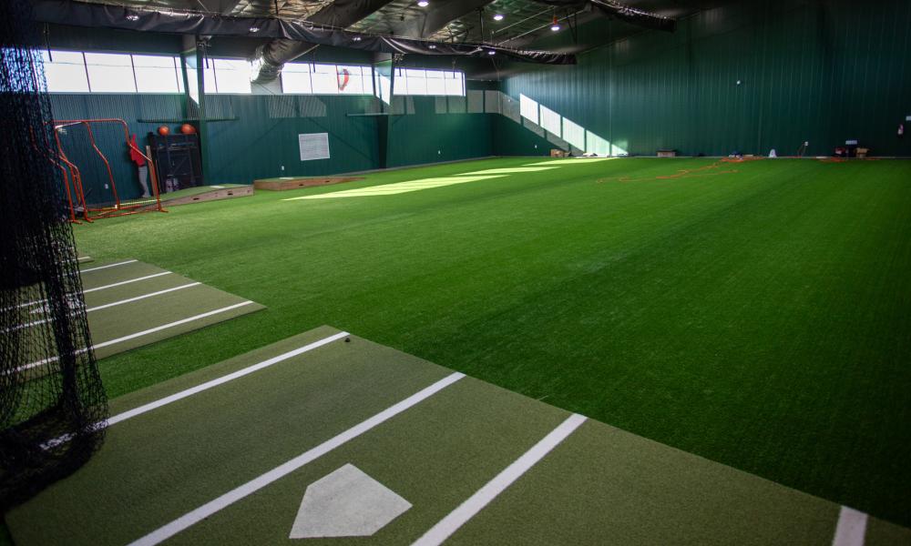 An interior photo of the indoor baseball and softball training facility within LTC's athletic performance center, The Barn