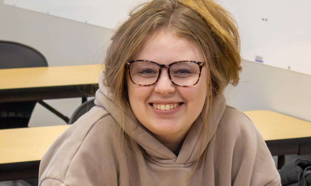 Lincoln Trail College student Elizabeth Womble smiles while seated in a classroom on campus.