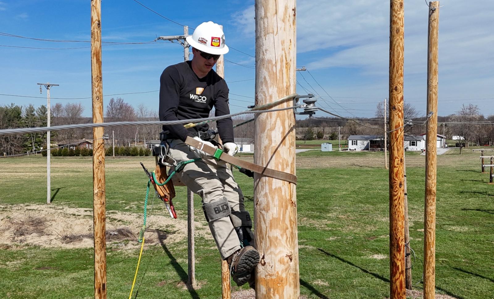 Electrical Distribution Systems student on pole