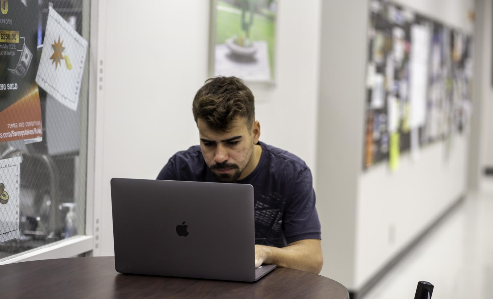 A Lincoln Trail College student studies at his computer