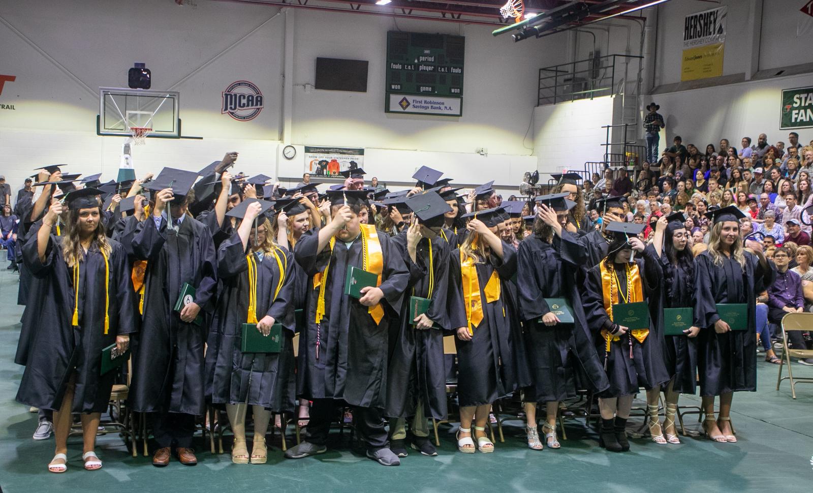 Lincoln Trail College graduates move the tassel on their caps during the graduation ceremony