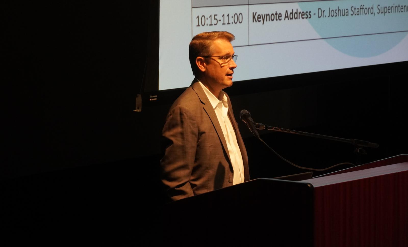 Dr. Ryan Gower welcomes people to the Dual Credit Summit