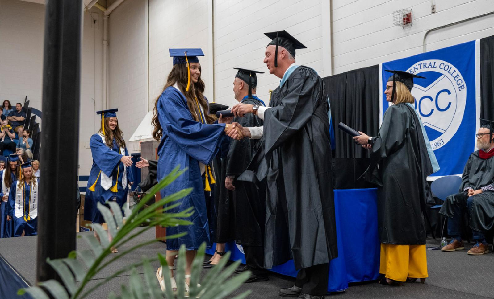 Photo of student receiving diploma