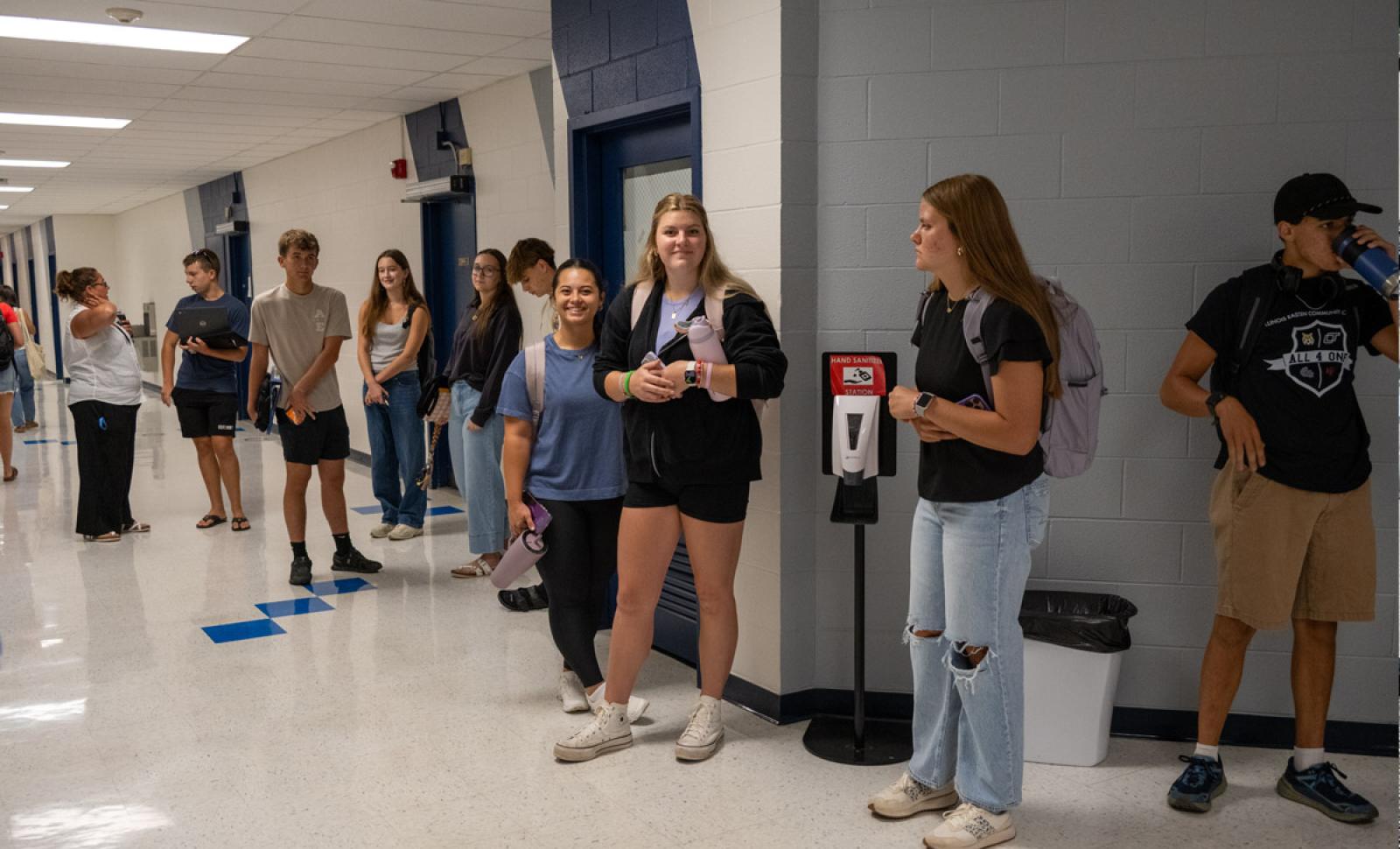 Photo of Students Standing in the hallway