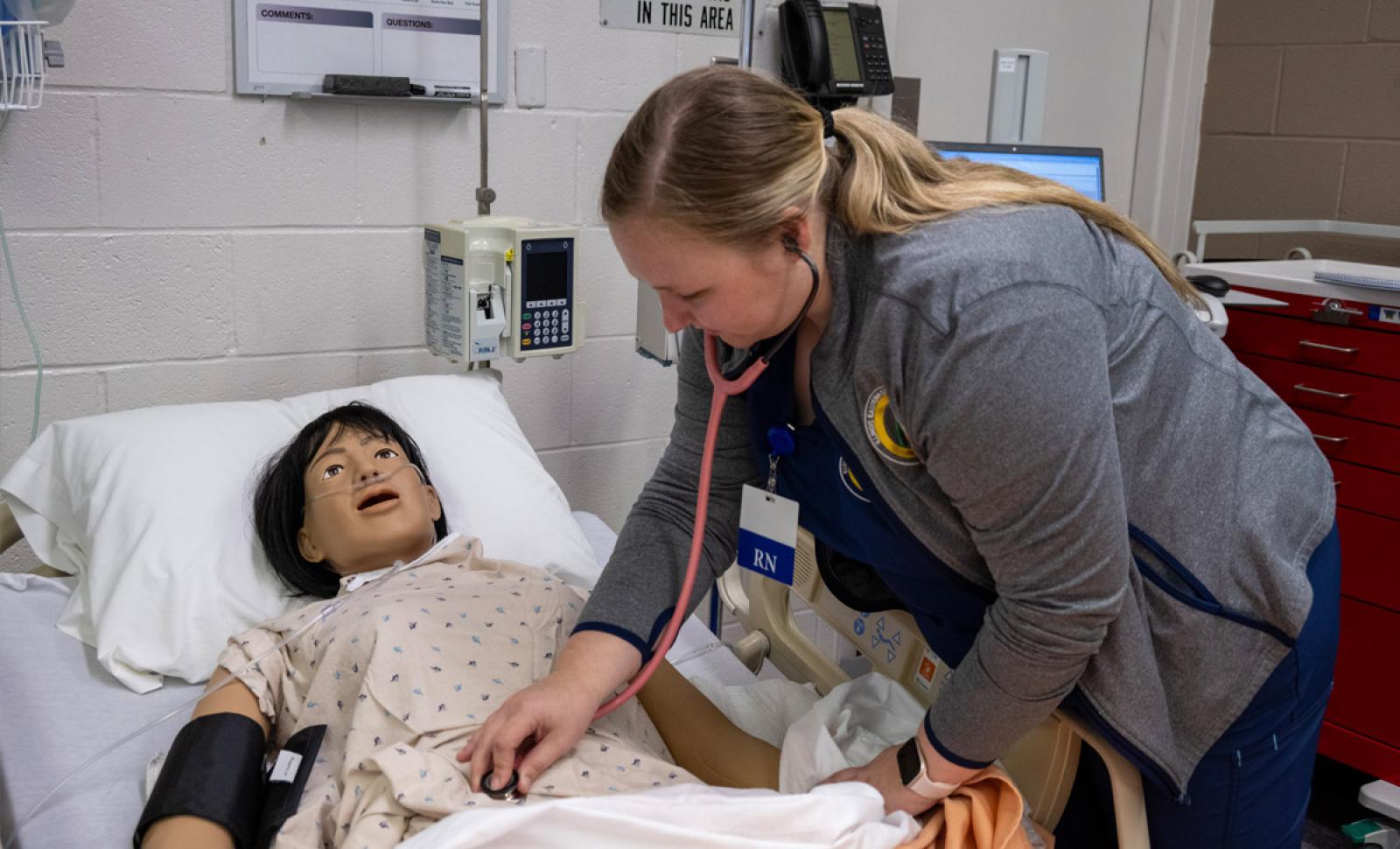 photo of nursing student taking patients vitals