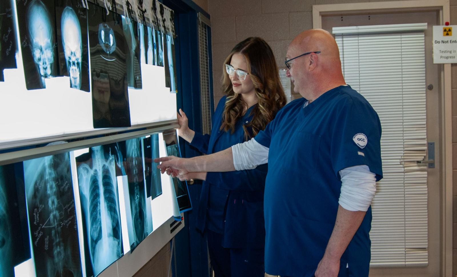 Radiography students looking at X-rays