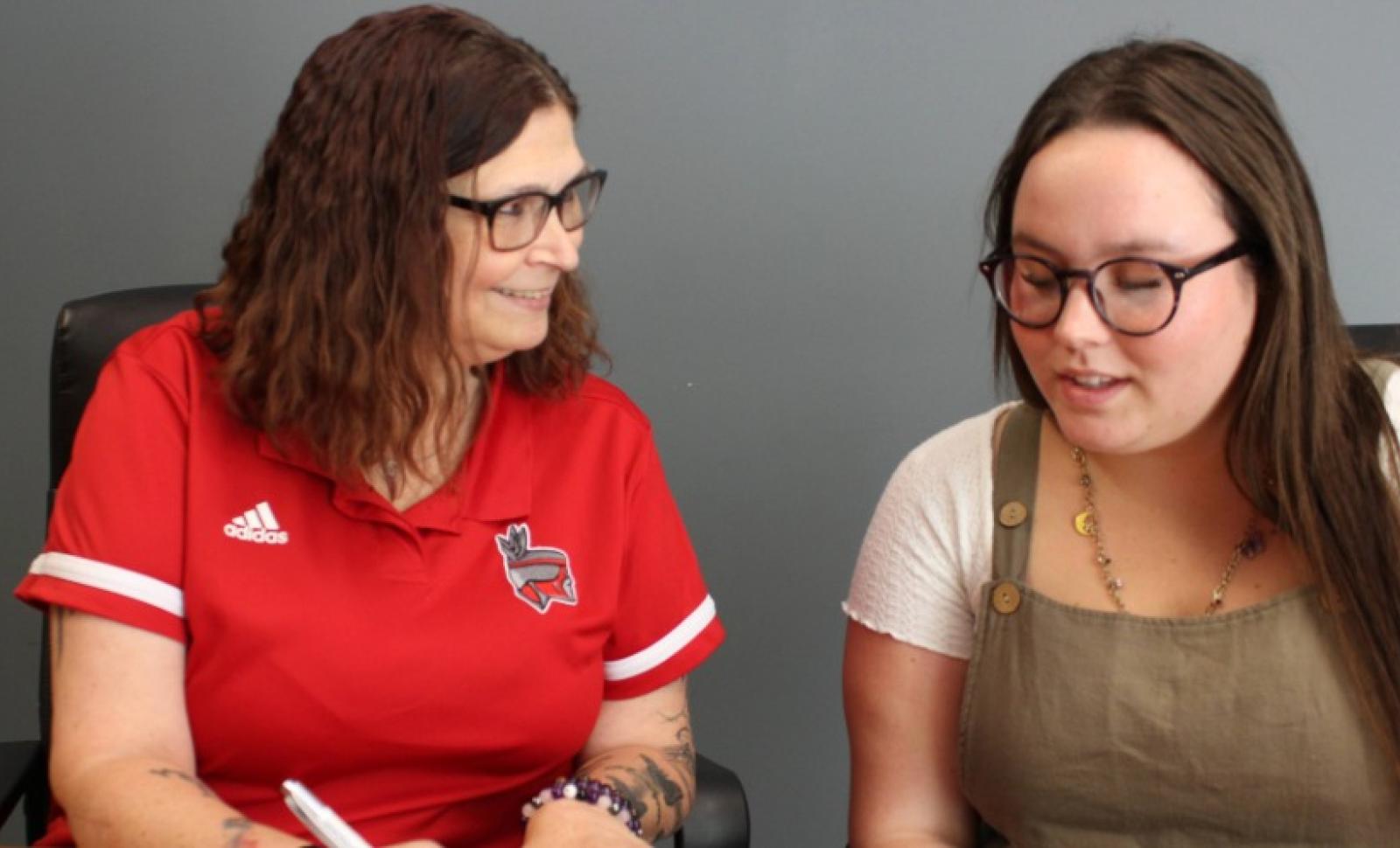 WVC Financial Aid representative smiling and helping a student 
