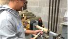 Student working in the woodworking class