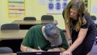 Teacher helping a student in a GED class