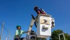 Dennis York instructs a Lincoln Trail College Broadband Telecom student on bucket truck operations