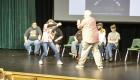 Actors on stage playing an improv game