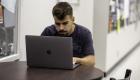 A student studies on a laptop