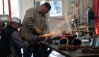 Photo of students cutting metal for batting cages