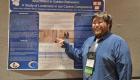 Photo of Robert Wray with his poster presentation