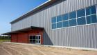 An exterior photo of Lincoln Trail College's athletic performance center, The Barn