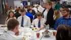 Students being served a meal at Lincoln Trail College's etiquette luncheon