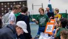 Jena Combs, wearing a T-shirt that says Best Decision Ever, talks with prospective students.