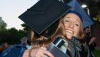 Photo of Students hugging after graduation