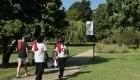 Students walk along a tree-lined path on the Wabash Valley College campus on a sunny day.