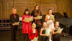 A children's choir at Lincoln Trail College performs at a concert.