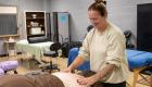 Student practices massage techniques in the classroom
