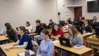 Students sit at desks using laptops during Elaine Hasty’s Spanish class at Lincoln Trail College, working on coursework in a computer classroom.
