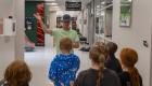 Lincoln Trail College student ambassador Landry Price leads students from the Boys and Girls Club of Crawford County on a tour through campus, introducing them to college life and campus spaces.
